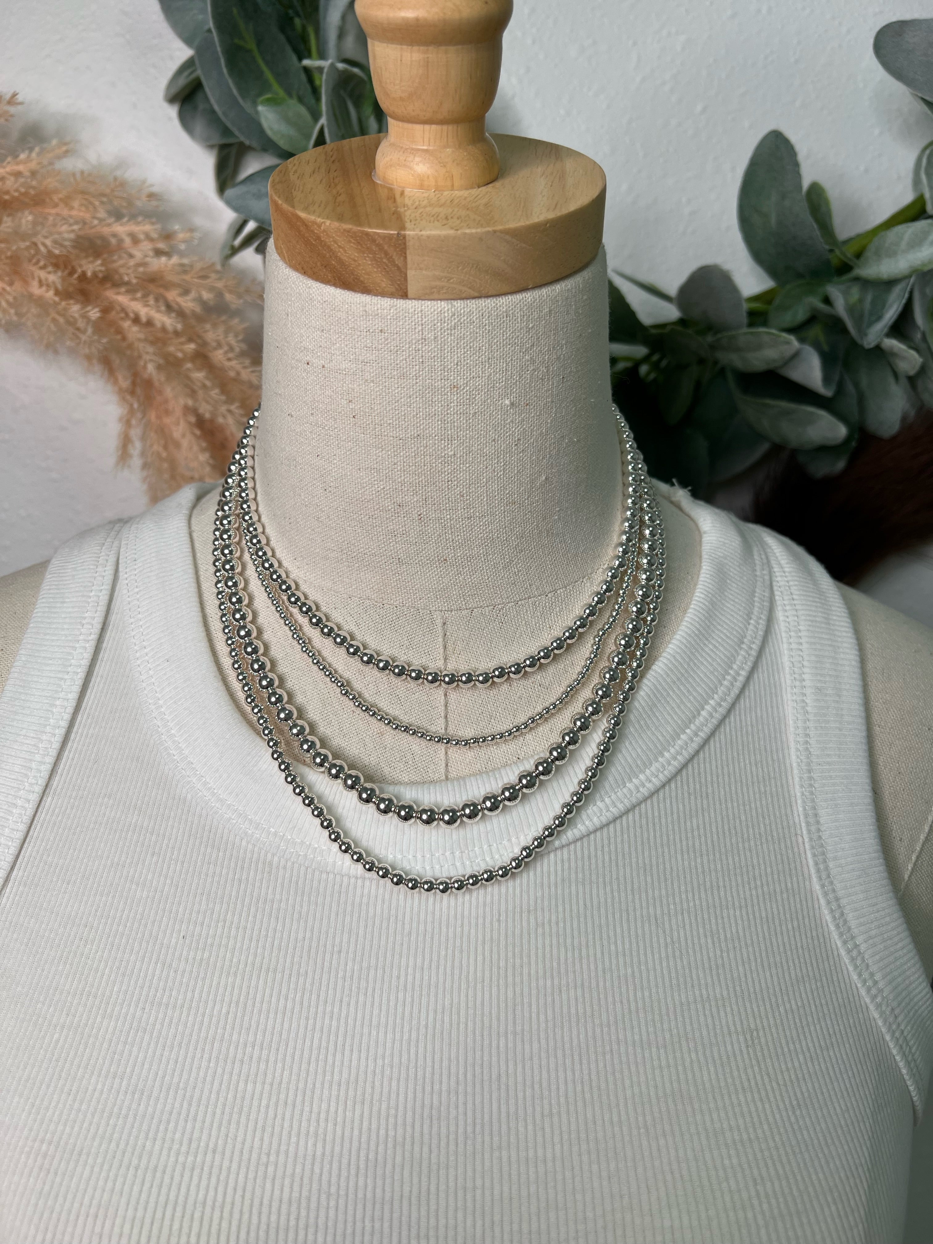 Multi strand silver bead necklace on sale